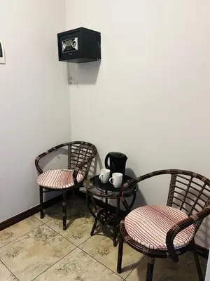 two chairs and a table in a room at Parow city -Star Legend Lodge in Cape Town