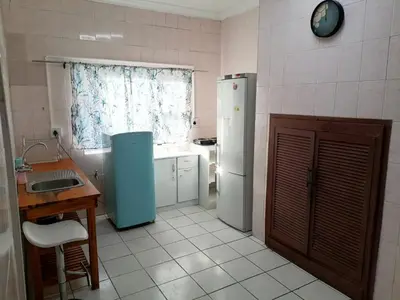 a kitchen with two refrigerators and a sink at 37 The trout Lodge in Cape Town