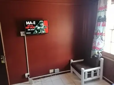 a corner of a room with a sign on a wall at 37 The trout Lodge in Cape Town