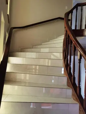 a staircase with wooden railings in a house at 160 On Townsend Guesthouse in Cape Town