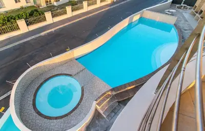 an overhead view of a swimming pool in a building at Ocean View 1004 Luxury Backup Power in Strand