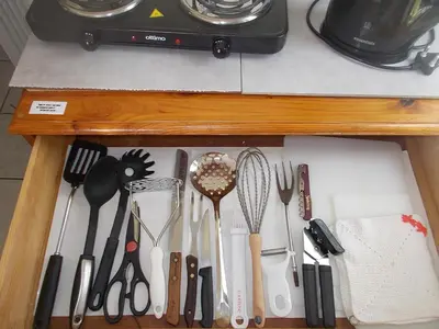 a drawer filled with cooking utensils on a counter at Erf 473 Fisherhaven in Fisherhaven