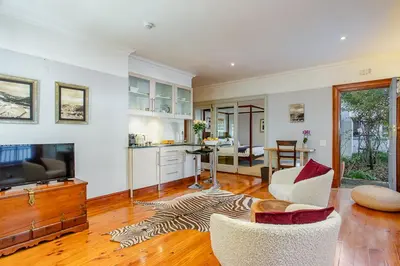 a kitchen and living room with a zebra rug at Franschhoek Manor in Franschhoek
