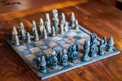 a chess set on a wooden table at Woodbridge Lodge in Cape Town