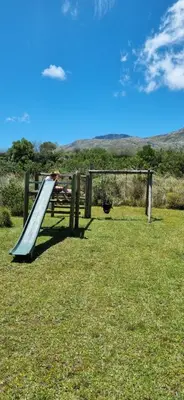 a person on a slide in the grass at 4859 Lakeside in Bettyʼs Bay