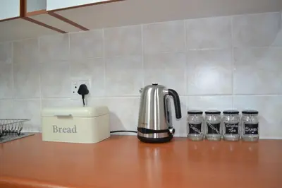 a coffee pot on a counter in a kitchen at Winecellar Cave, on wine farm & where lions roar! in Stellenbosch