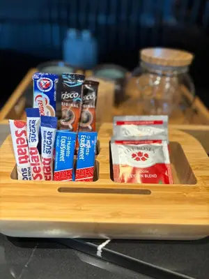 a wooden tray with different types of snacks on it at ZALS Luxury Accommodation-One bed-Cape Town in Cape Town