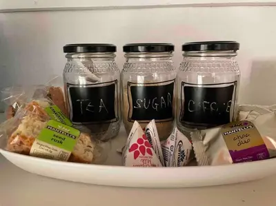a group of jars of food in a refrigerator at Mouse House Greyton - tiny home living in Greyton