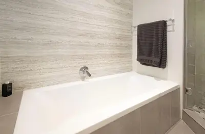 a bathroom with a sink and a faucet at House La Gratitude - secure parking in Stellenbosch