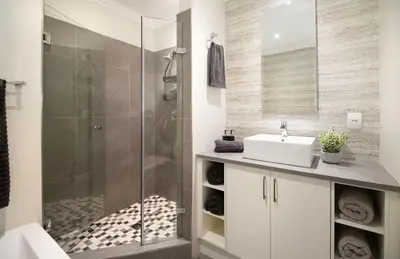 a bathroom with a sink and a shower at House La Gratitude - secure parking in Stellenbosch