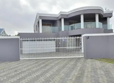 a house with a white gate and a fence at KBJ House in Cape Town
