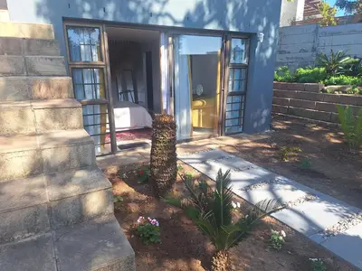 a house with a door leading to a bedroom at Governor's nest in Cape Town