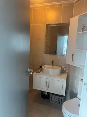 a bathroom with a sink and a toilet at Clouds in Strand