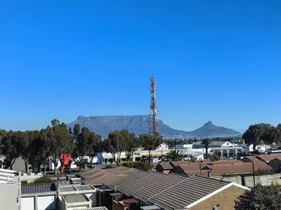 a view of a suburb with mountains in the background at Ultra-Modern Studio Apartment in Table View