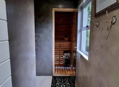 a bathroom with a walk in shower next to a window at C'est la Vie 1 in Franschhoek