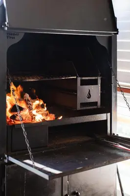 a pizza being cooked in an oven at Hephzibah Inn River Cabin in Hermon
