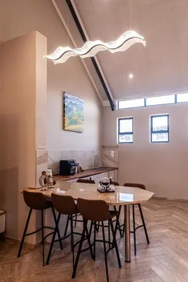 a kitchen with a table and chairs in a room at Serenity Vista Retreat in Cape Town