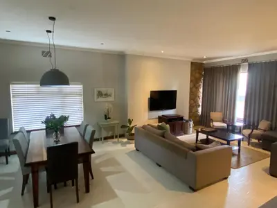 a living room with a couch and a table at 33 Tafelberg! in Cape Town