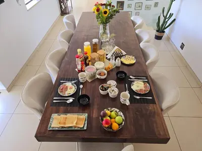 a wooden table with food and drinks on it at Die Regte Rede in Cape Town