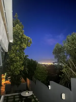 a view of the city from a balcony at night at Somerset-West PRIME SPOT- Solar Powered! in Cape Town