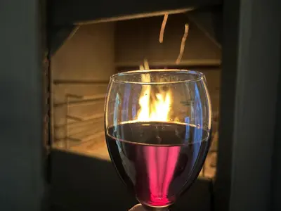 a wine glass with a fire inside of it at Mountain Views, beach walks, heart of old village in Gordonʼs Bay