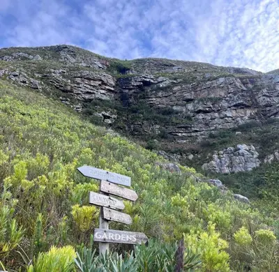a sign on the side of a mountain at Awesome room in surf house in Hermanus
