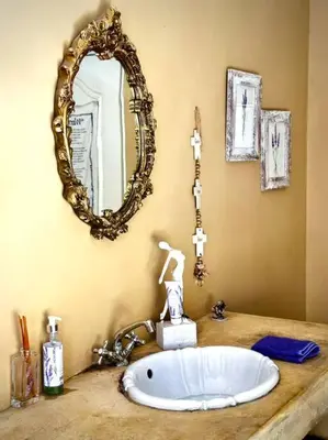a bathroom with a sink and a mirror on a counter at Tuscan Farmhouse near Franschhoek in Simondium