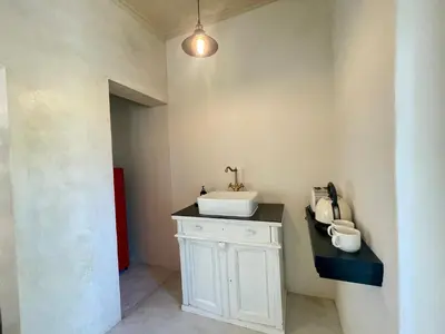 a bathroom with a white sink in a room at La Rose Quartier in Wellington