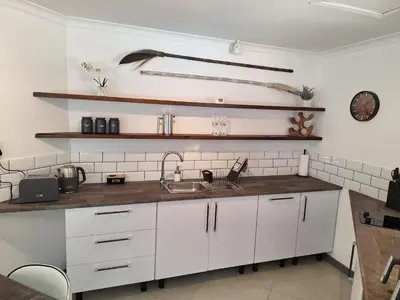 a kitchen with white cabinets and a sink at Dee-Ones at Witboom,Kenridge ,Self Catering Apartment in Kenridge