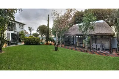 a house with a gazebo in a yard at TUSCAN VILLA FELICE near West Coast in Cape Town