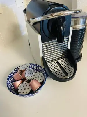 a bowl of eggs and a coffee maker on a counter at Somerset West Family home holiday rental in Cape Town