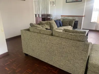a living room with a couch and two couches at House on Gill 2 in Cape Town