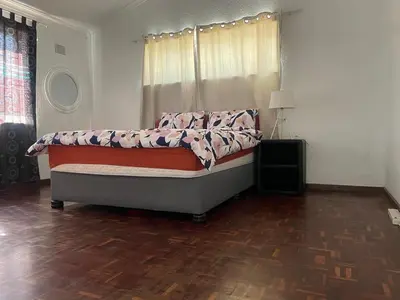 a bedroom with a bed in a room at House On Gill 3 in Cape Town
