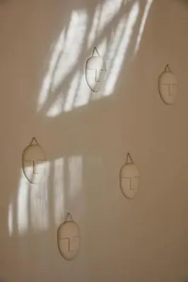 a wall with a bunch of lights on a wall at Kokon Boutique Guesthouse in Somerset West
