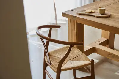 a wooden chair sitting next to a wooden table at Kokon Boutique Guesthouse in Somerset West