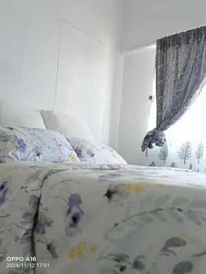 a bedroom with a bed and a window at KK Guesthouse in Cape Town