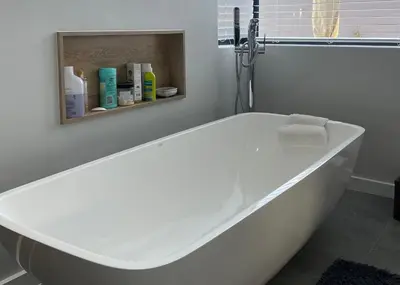 a white bath tub sitting in a bathroom at The View in Cape Town