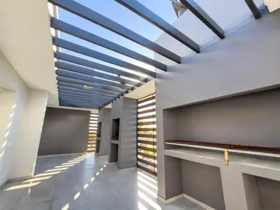 a hallway with a skylight in a building at Greystone Executive Apartments in Cape Town