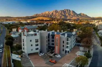 an aerial view of a city with a mountain in the background at The Den at 41- Parking included in Stellenbosch