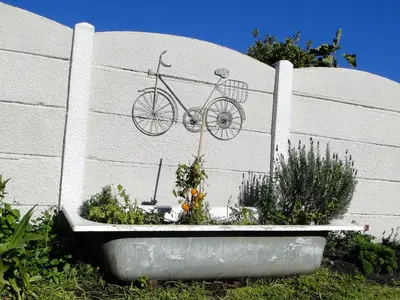 a bike is hanging on the side of a wall at Our Nest Guest House in Kleinmond