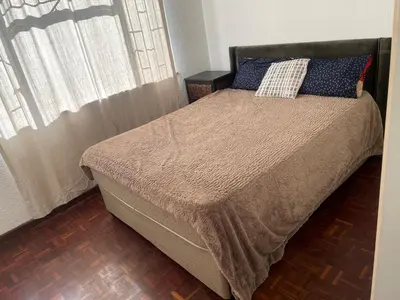 a bed with two pillows on it in a bedroom at Mary's Cape in Cape Town