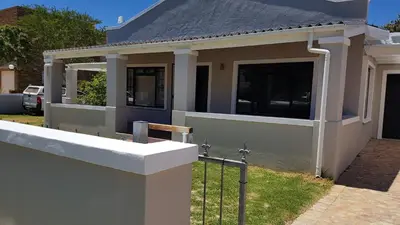 a house with a fence in front of it at no 5 King Street, Onrus in Hermanus