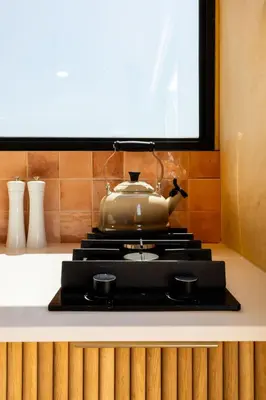 a tea pot sitting on top of a stove at Stellenbosch Farm Cabin - Klein Frans in Stellenbosch