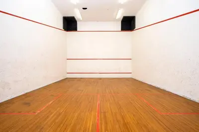 an empty room with a wooden floor and white walls at 47 Whale Rock Estate in Hermanus