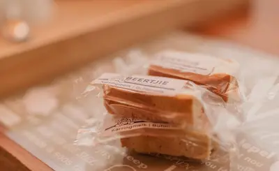 two pieces of food in plastic bags on a table at The Attic - Deluxe Leisure Loft in Stellenbosch