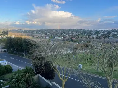 a view of a city with a road and trees at Divine View in Cape Town