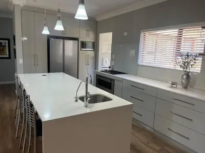 a kitchen with a sink and a white counter top at Divine View in Cape Town