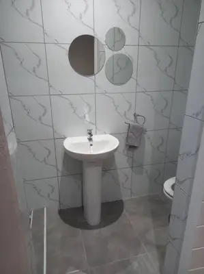 a bathroom with a sink and a toilet at Entire Spacious Guest suite in Cape Town in Cape Town