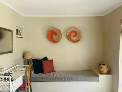 a room with two hats on the wall at Eight on Tuin in Franschhoek