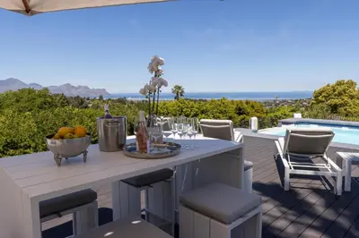 a table with a bowl of fruit on a patio at Waveren's Nest in Cape Town